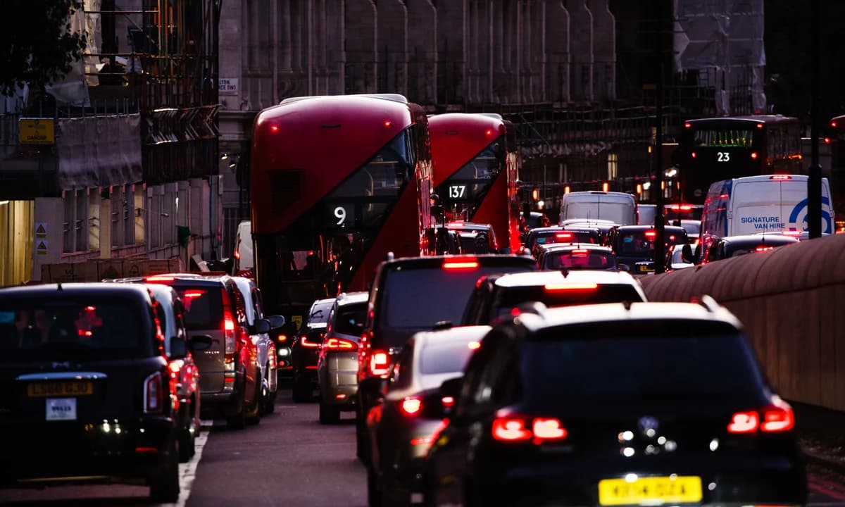 London traffic — buses and taxis at dusk